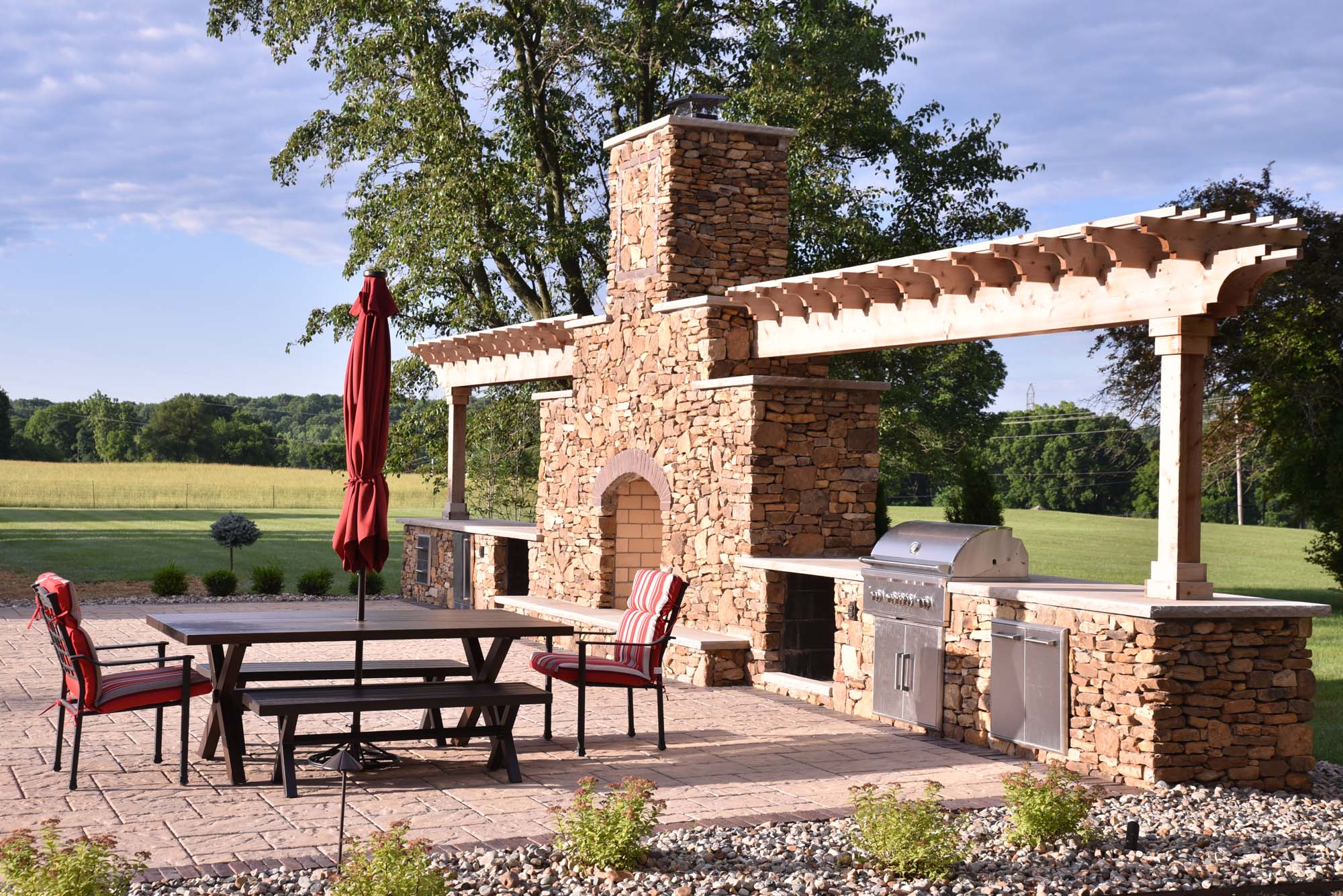 Custom outdoor fireplace and grilling island